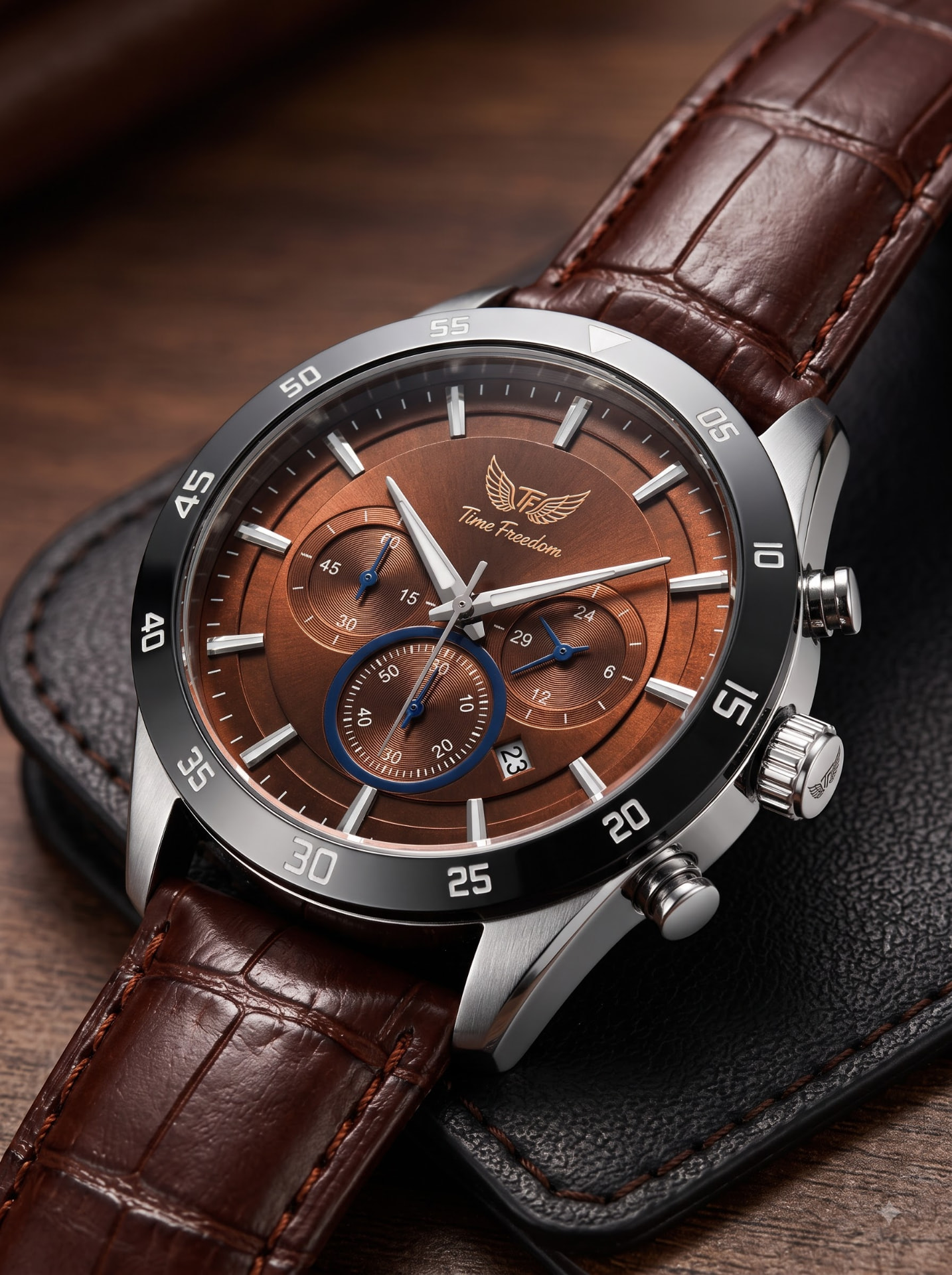 Close-up of a Time Freedom chronograph with brown leather strap
